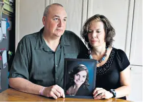  ??  ?? Lasting legacy: Gordon and Kathleen Stringer hold a picture of their daughter, Rowan