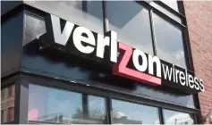  ??  ?? A sign hangs outside of a Verizon store in Chicago, Illinois. US telecomm group Verizon announced it would slash its workforce through a voluntary buyout plan as the company strives to better position itself for the coming of new cellular technology. – AFP photo