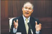  ?? AP File Photo ?? Then-Oklahoma Attorney General Scott Pruitt gestures as he answers a question June 13, 2013, during a news conference in Oklahoma City.