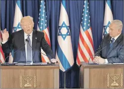  ?? AP PHOTO ?? U.S. President Donald Trump, left, talks during a briefing after his meeting with Israeli Prime Minister Benjamin Netanyahu in Jerusalem on Monday.
