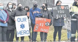  ?? TINA COMEAU ?? Paramedics, other first responders, Yarmouth Regional Hospital staff, family and friends gathered outside the home of Yarmouth paramedic on Feb. 9, the day he died, to honour Muise who had a huge impact in his community and beyond.