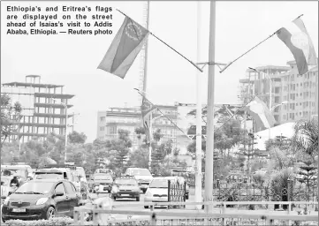  ??  ?? Ethiopia’s and Eritrea’s flags are displayed on the street ahead of Isaias’s visit to Addis Ababa, Ethiopia. — Reuters photo