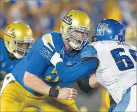  ?? Mark J. Terrill
Associated Press ?? CENTER JAKE BRENDEL, middle, is part of an experience­d UCLA offensive line that quarterbac­k Jerry Neuheisel calls “the best I have ever been around.”