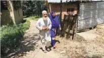  ?? Sameer Yasir/Los Angeles Times/TNS ?? n Mohammad Munawar Dar, left, and Mehmooda Wani are parents of militants battling Indian forces in Kashmir.