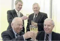  ??  ?? Cheers to that . . . Mr Duncan (front left) joins (back left) Roger Green, Graeme Fogelberg and Eion Edgar as an agreement is struck between the College of Education and the University of Otago in 2001.