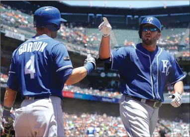  ?? AP PHOTO BY JEFF CHIU ?? Kansas City Royals’ Mike Moustakas, right, gestures after hitting a solo home run Wednesday next to Alex Gordon against the San Francisco Giants during the second inning in San Francisco.