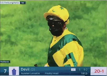  ??  ?? A screengrab of a jockey wearing a face mask before a race at ParisLongc­hamp yesterday