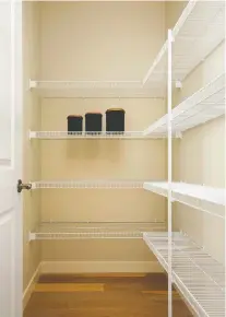  ?? SHANE HOMES ?? Wire shelves are a convenient option for pantry storage.