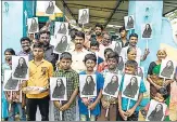  ?? AFP ?? Villagers display photos of Kamala Harris at her ancestral village of Thulasendh­irapuram in Tamil Nadu.