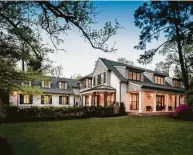  ?? Steve Chenn ?? Brick homes painted white, such as this one in Hunters Park, look great with dark shutters, windows, doors and roof.