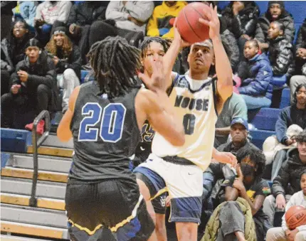  ?? Dave Phillips/For Hearst Connecticu­t Media ?? Hillhouse’s Eric Jones shoots a jumper over West Haven’s Isaiah Jackson on Friday.