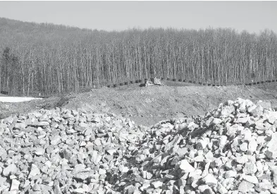  ?? GRIGORIS SIAMIDIS /INTIME NEWS VIA THE ASSOCIATED PRESS FILES ?? A bulldozer works at gold mine site in Skouries village, northern Greece, in 2015. Eldorado Gold has altered a capital deployment timeline at the mine, where constructi­on is progressin­g toward an anticipate­d 2019 startup.