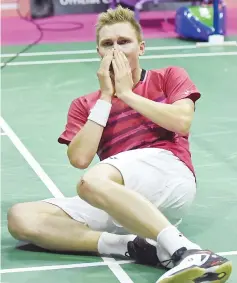  ??  ?? Denmark’s Viktor Axelsen celebrates his win over China’s Lin Dan in their men’s singles final match during the 2017 BWF World Championsh­ips of badminton at Emirates Arena in Glasgow on August 27, 2017. - AFP photo