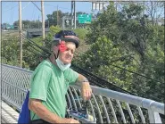  ?? HOLLY HERMAN — MEDIANEWS GROUP ?? Bill Keenan, 80, of West Norriton Township, Montgomery County, stops Monday on the Sullivan’s Bridge bike path to view the newly renovated Route 422 bridge, known as the Betzwood Bridge, next to the bike path.