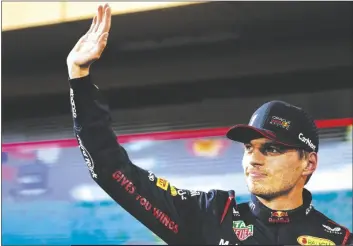  ?? ARIEL SCHALIT/AP ?? RED BULL DRIVER MAX VERSTAPPEN of the Netherland­s reacts as he finishes at pole position during the Formula One qualifying at the Bahrain Internatio­nal Circuit in Sakhir, Bahrain on Saturday.