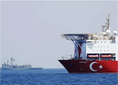  ?? Reuters ?? Turkish drilling vessel Yavuz is escorted by Turkish Navy frigate TCG Gemlik (F-492) in the eastern Mediterran­ean Sea off Cyprus.