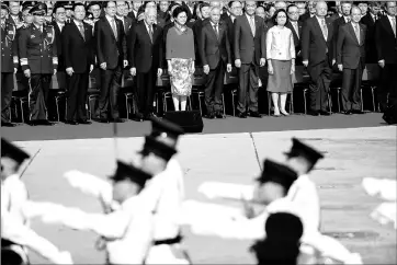  ??  ?? Hong Kong Chief Executive Leung Chun-ying, Lam and other officials attend a flag raising ceremony. — Reuters photo