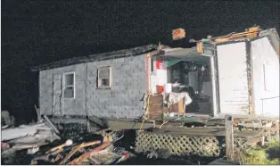  ?? SUBMITTED PHOTO BY RICHARD (DUBSY) HARDY ?? A Nov. 23 storm ripped open the side of Joe Gale’s cabin near Red Rocks, about 10 minutes outside of Port aux Basques.