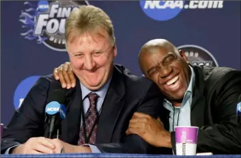  ??  ?? In this 2009 file photo, former NBA players Earvin “Magic” Johnson, right, and Larry Bird share a laugh at a news conference before the championsh­ip game between Michigan State and North Carolina at the men’s NCAA Final Four college basketball tournament in Detroit. AP PhoTo/AMy SAnceTTA