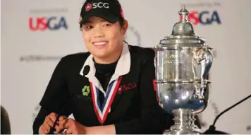  ?? — USA Today Sports ?? Ariya Jutanugarn poses with the championsh­ip trophy after defeating Hyo-joo Kim (not pictured) in a sudden death playoff in the US Women’s Open Championsh­ip at Shoal Creek.
