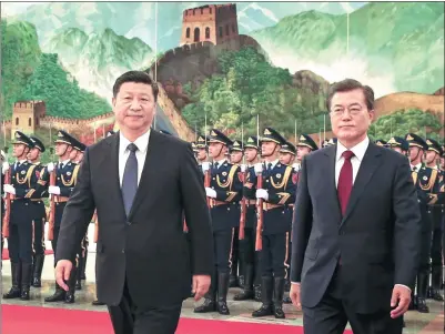  ?? WU ZHIYI / CHINA DAILY ?? President Xi Jinping accompanie­s Republic of Korea President Moon Jae-in at a welcoming ceremony at the Great Hall of the People in Beijing on Thursday.