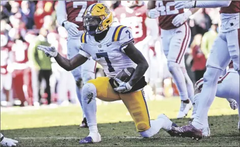  ?? MICHAEL WOODS/AP ?? LSU WIDE RECEIVER KAYSHON BOUTTE (7) reacts after making a first down against Arkansas during a game on Nov. 12, 2022 in Fayettevil­le, Ark.