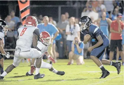  ?? PHELAN M. EBENHACK/ORLANDO SENTINEL ?? Foundation Academy’s Bryan Thomas, pictured running the ball against Windermere Prep on Oct. 5, 2018, leads the Lions into the 2020 season against Orangewood Christian on Friday night.