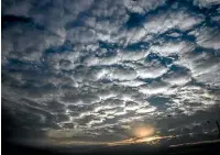  ?? AP ?? Sun sets behind a patterned cloud formed over the city in Kolkata, West Bengal state, India. Cylone Amphan has intensifie­d into a super cyclone over the Bay of Bengal and was expected to hit near the Sundarbans, south of Kolkata, last night.