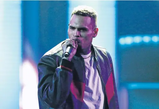  ?? MATT SAYLES INVISION/THE ASSOCIATED PRESS FILE PHOTO ?? Chris Brown has continued to score hits since the incident with Rihanna. How does he keep getting a free ride, especially in the #MeToo era, Ben Rayner writes.