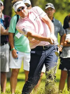  ?? THE ASSOCIATED PRESS ?? Ian Poulter hits his third shot on the 13th hole during the third round of the Houston Open on Saturday in Humble, Texas.