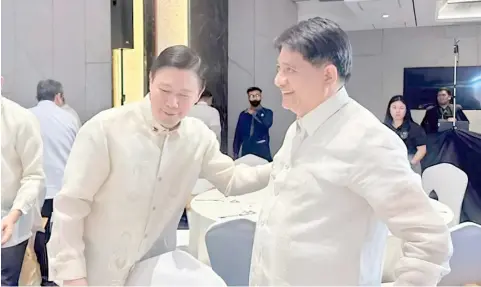  ?? PHOTOGRAPH COURTESY OF PHILHEALTH ?? PHILHEALTH’S CEO Emmanuel Ledesma welcomes Presidenti­al Adviser on Poverty Alleviatio­n Secretary Larry Gadon (right) who gave the keynote address for the 29th anniversar­y of the premier health agency.