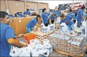  ?? CONTRIBUTE­D ?? Volunteers prepare supplies. MAP Internatio­nal is working with groups like Convoy of Hope.