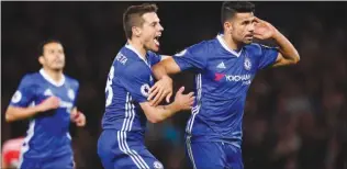  ??  ?? Diego Costa celebrates scoring his second goal against Southampto­n