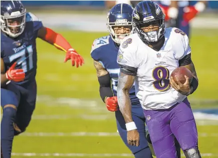  ?? BRETT CARLSEN/ AP ?? Ravens quarterbac­k Lamar Jackson runs for a touchdown against the Titans during the second quarter Sunday.