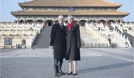  ?? Picture: Getty. ?? Theresa May and husband Philip visit the Forbidden City in Beijing during their trip to China.