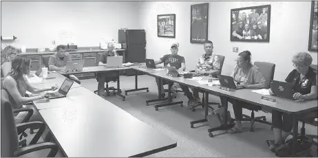  ?? Mona Weatherly ?? Pictured at Monday night’s Broken Bow School Board meeting are, clockwise from left: Amy Staples, guest; Kay Einsphar, secretary; Darren Tobey, superinten­dent; Tom Osmond, president; Gerald Pirnie; Tim Chancellor, Pam Holcomb; and Mary Shaw. Board treasurer JB Atkins was excused.