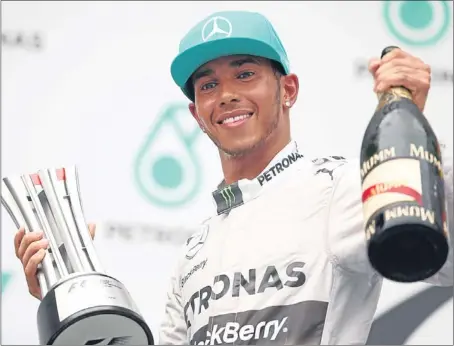  ?? Picture: Getty Images. ?? Lewis Hamilton celebrates his first win in Malaysia and the 23rd of his F1 career.