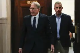  ?? FRANK FRANKLIN II — THE ASSOCIATED PRESS ?? Wayne LaPierre, left, former longtime leader of the National Rifle Associatio­n, leaves court in New York on Wednesday.