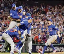  ?? AP ?? The Cubs celebrate after winning the World Series in 2016.