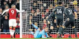  ?? AP ?? Arsenal's Alexandre Lacazette (left), fails to score past Manchester United goalkeeper David de Gea during their match in London on Saturday.