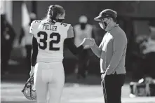  ?? [AP PHOTO/L.G. PATTERSON] ?? Vanderbilt place kicker Sarah Fuller (32) gets a fist-bump from Missouri head coach Eliah Drinkwitz after warming up Saturday in Columbia, Mo.