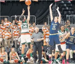  ?? JC RIDLEY/COURTESY ?? Adrienne Motley puts up a shot during Sunday’s victory by the Miami Hurricanes women’s basketball team. She had 17 points against Georgia Tech.