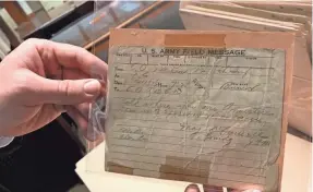  ?? MEG JONES / MILWAUKEE JOURNAL SENTINEL ?? Among unusual items in the Wisconsin Veterans Museum’s archives is this field telegram sent on Nov. 11, 1918, to Wisconsin National Guard troops preparing an advance against German front lines.