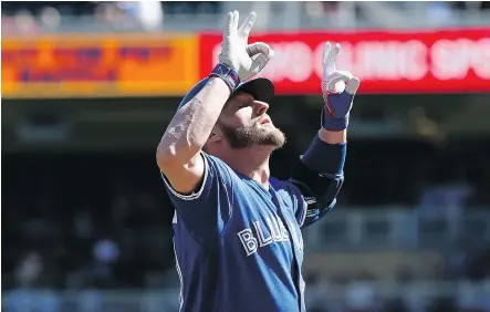  ?? THE ASSOCIATED PRESS ?? Toronto Blue Jays’ Josh Donaldson celebrates after homering against the Minnesota Twins on Sunday in Minneapoli­s. Donaldson had a pair of homers in a 13-7 loss, giving him 30 for the season, only the second Jay to hit 30 or more in each of his first...