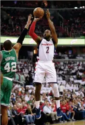  ?? ASSOCIATED PRESS ?? WASHINGTON WIZARDS GUARD JOHN WALL (2) shoots against Boston Celtics center Al Horford (42) during the first half in Game 4 of a second-round playoff series Sunday in Washington.