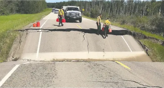  ??  ?? The hamlet of Marten Beach has been evacuated and a local state of emergency has been declared after heavy rainfall caused flooding and washed out highways Thursday.