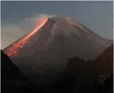  ?? AFP VIA GETTY IMAGES FILE PHOTO ?? AGUNG SUPRIYANTO
Lava flows down Mount Merapi, Indonesia’s most active volcano, in July.