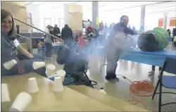  ?? STAFF PHOTOS BY ANDREW RICHARDSON ?? Right, the “Vortex Cannon” uses sound waves and fog to knock over a pyramid of Styrofoam cups.