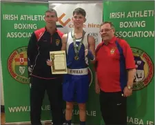 ??  ?? New Irish champion Sean Crowley with coaches Alistair Crowley and Jim Moore.