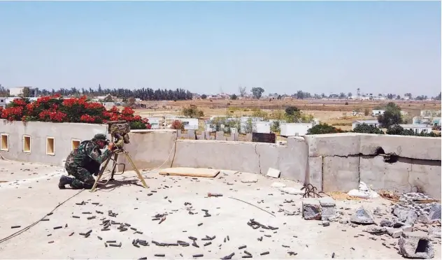  ?? Reuters ?? ↑ A member of the Libyan internatio­nally recognised government forces is seen during a fight with Eastern forces in southern Tripoli.